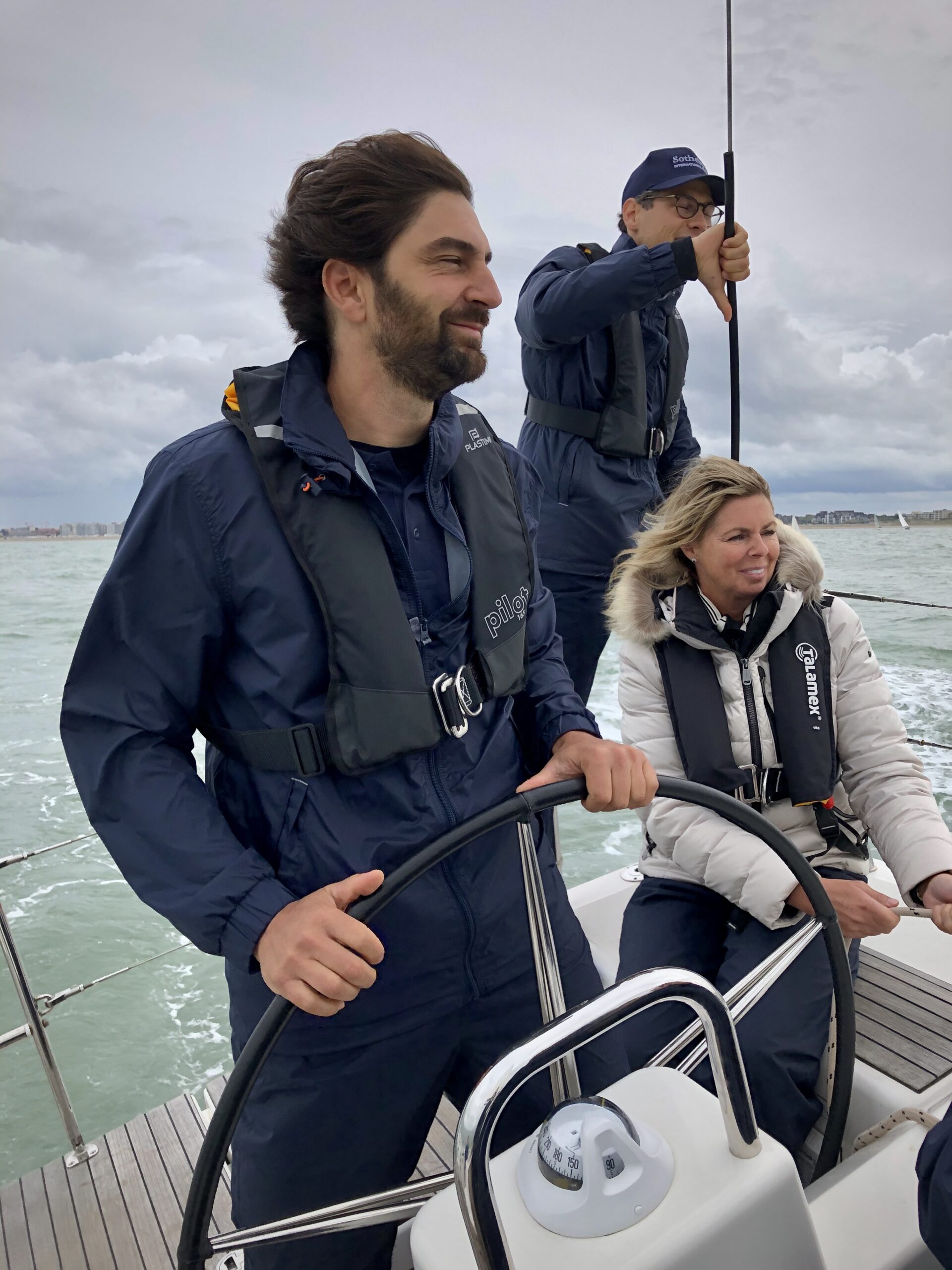 Our managing director, David Chicard, steering the boat during the sailing race for real estate leaders. 